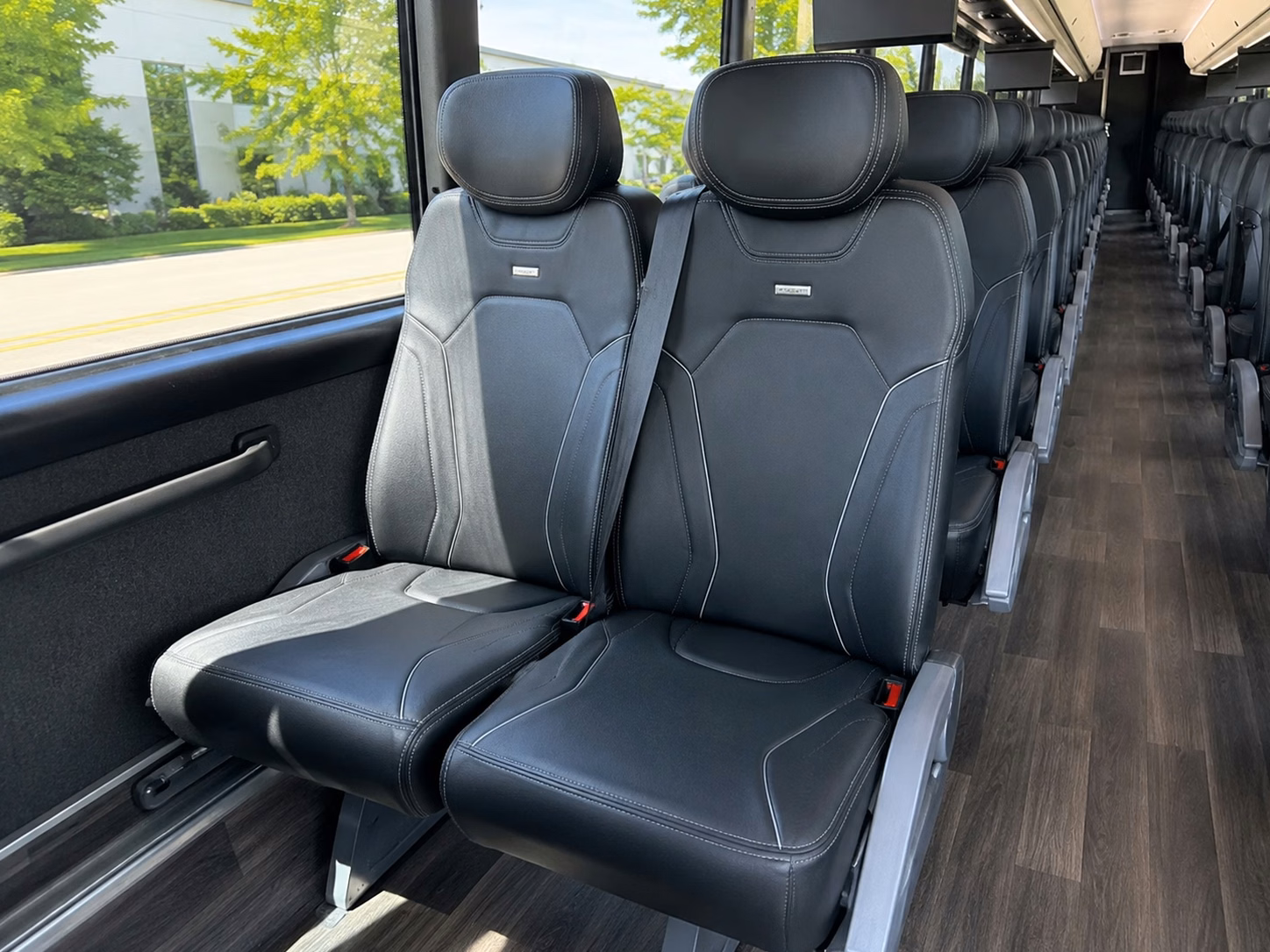 rather than splitting your wedding party into rideshares keep everyone together on one bus
